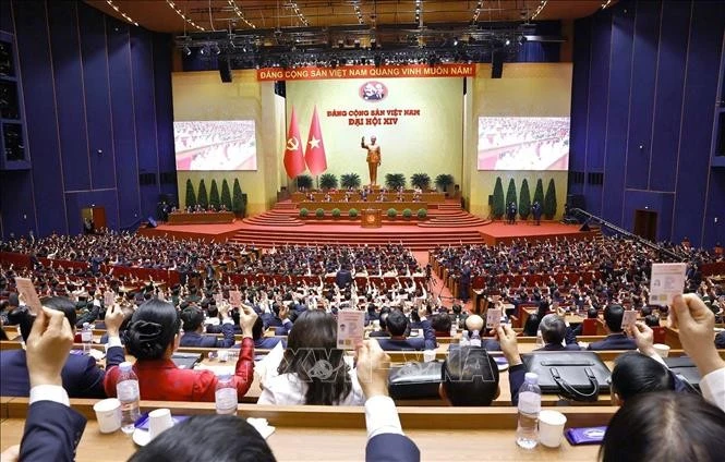 Delegates at the 14th National Party Congress vote on the list of candidates to the 14th Party Central Committee. (Photo: VNA)