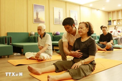Elderly people take part in activities at a daytime care centre for senior citizens. (Photo: VNA)
