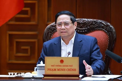 Prime Minister Pham Minh Chinh speaks at the meeting between the Government’s standing members and ministries, sectors and localities on December 16 on preparations for the ground-breaking and inauguration ceremonies for projects celebrating the 14th National Party Congress. (Photo: VNA)