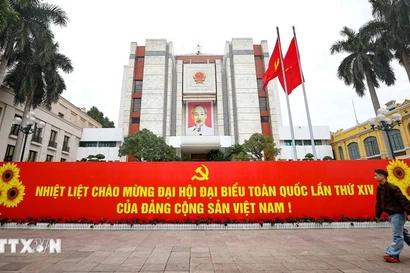 Banner welcoming the 14th National Congress of the Communist Party of Vietnam displayed in front of the Hanoi People’s Committee headquarters. (Photo: VNA)