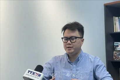 Enzo Sim Hong Jun, a Malaysian researcher specialising in Southeast Asian history and defence, grants an interview to the Vietnam News Agency. (Photo: VNA)