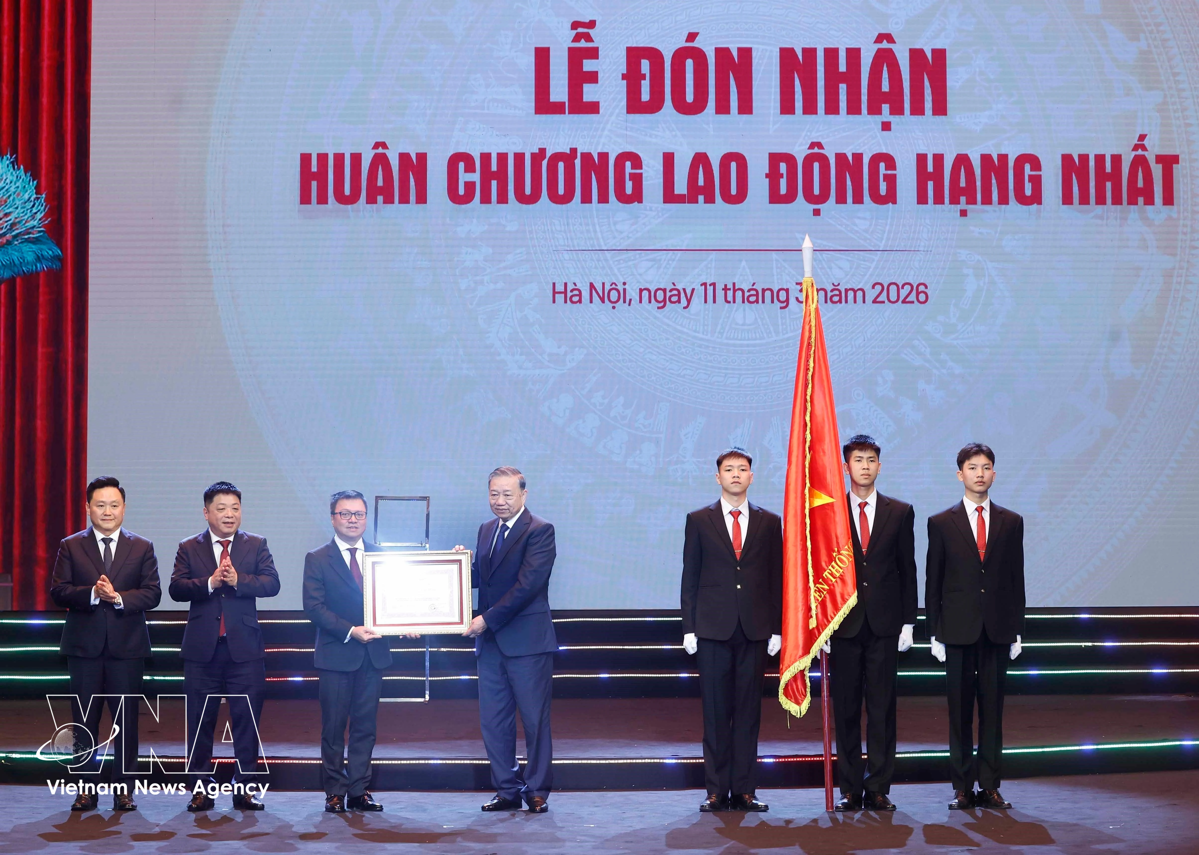 Party General Secretary To Lam presents Nhan Dan newspaper with the first-class Labour Order on March 11. (Photo: VNA)