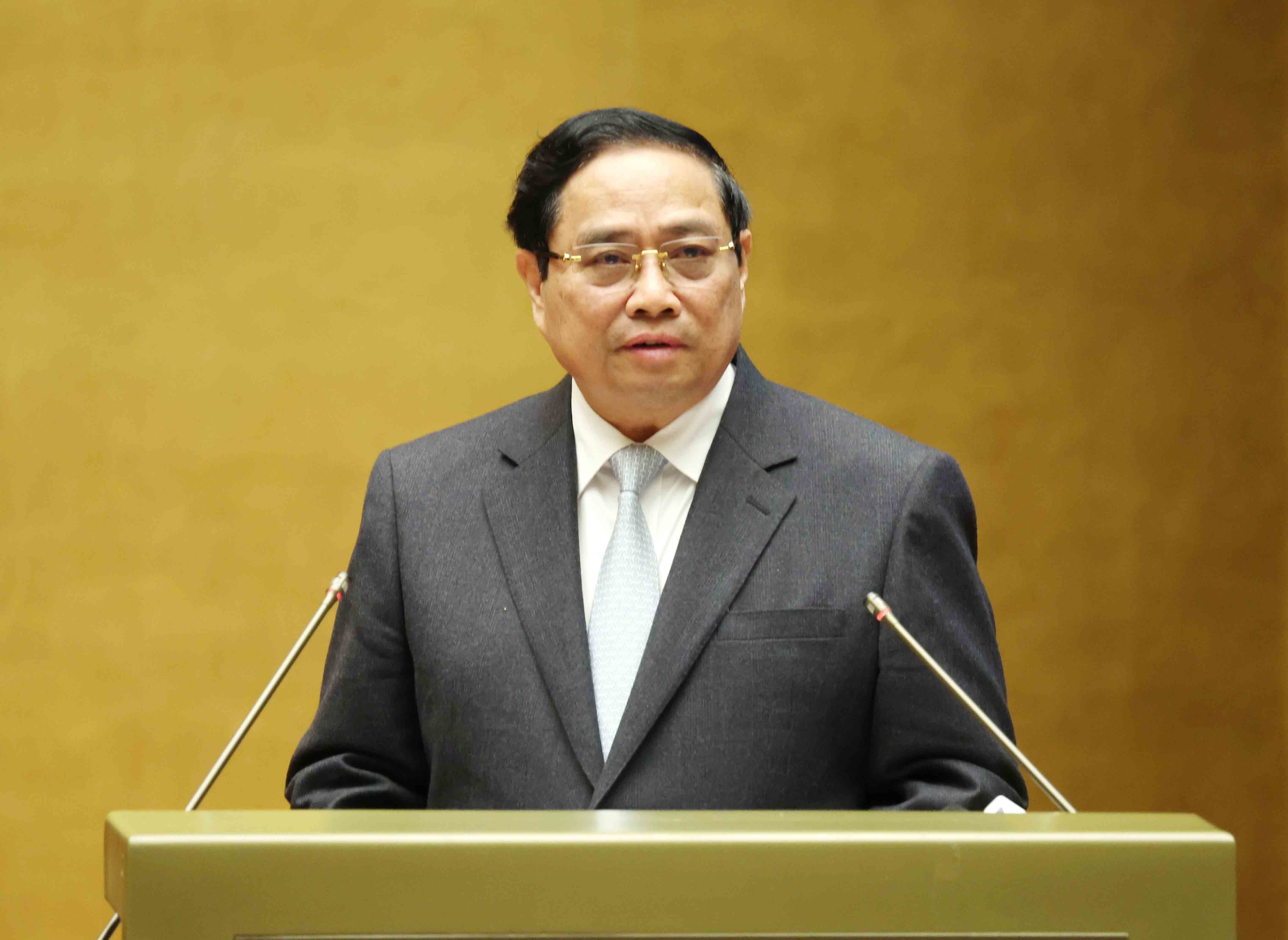 Prime Minister Pham Minh Chinh presents the action plan for implementing the Resolution of the 14th National Party Congress at the conference on February 7. (Photo: VNA)
