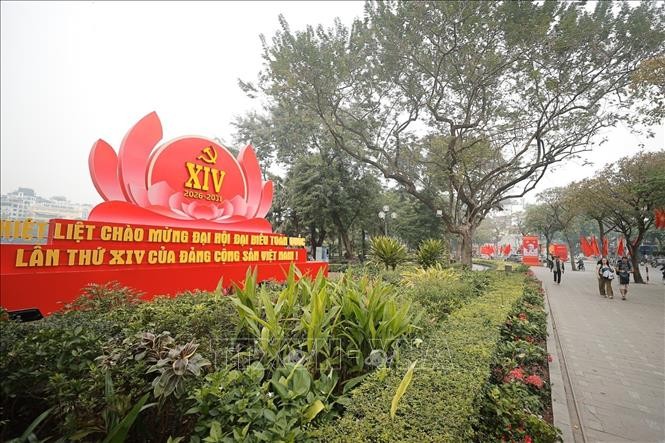 Banners, posters and symbols of the 14th National Party Congress are displayed along streets in Hanoi. (Photo: VNA)