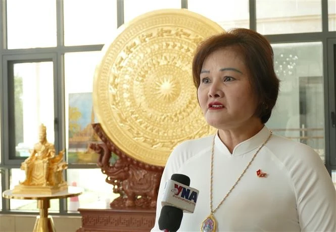 Pham Thi Minh Huong, Chairwoman and General Director of Gold Phuc company, member of the standing board of the General Association of Vietnamese in Laos, speaks to Vietnam News Agency correspondent in Laos ahead the 14th National Party Committee. (Photo: VNA)