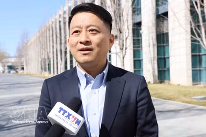 Professor Qu Qiang, commentator for the China Global Television Network (CGTN) and lecturer at the Minzu University of China, in an interview with the Vietnam News Agency. (Photo: VNA)