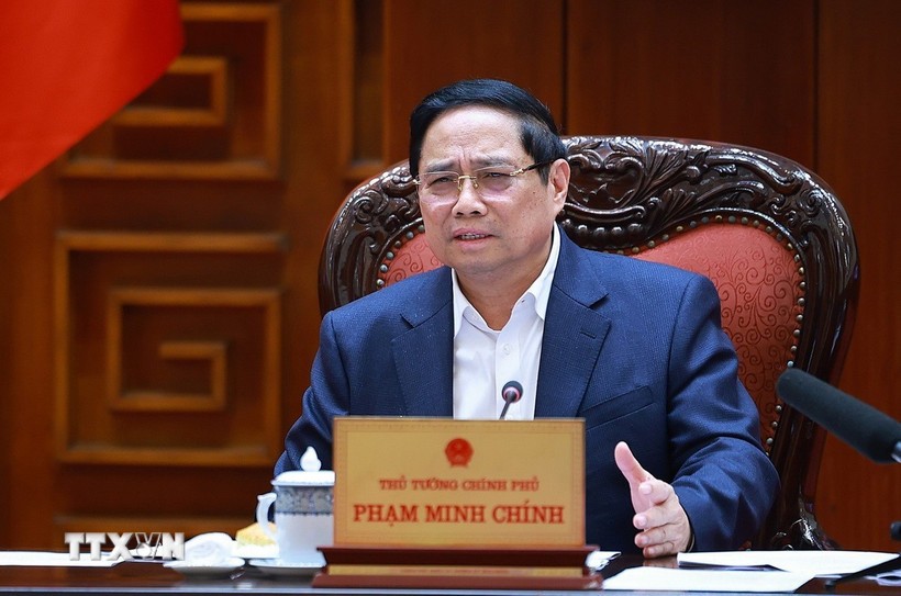 Prime Minister Pham Minh Chinh speaks at the meeting between the Government’s standing members and ministries, sectors and localities on December 16 on preparations for the ground-breaking and inauguration ceremonies for projects celebrating the 14th National Party Congress. (Photo: VNA)