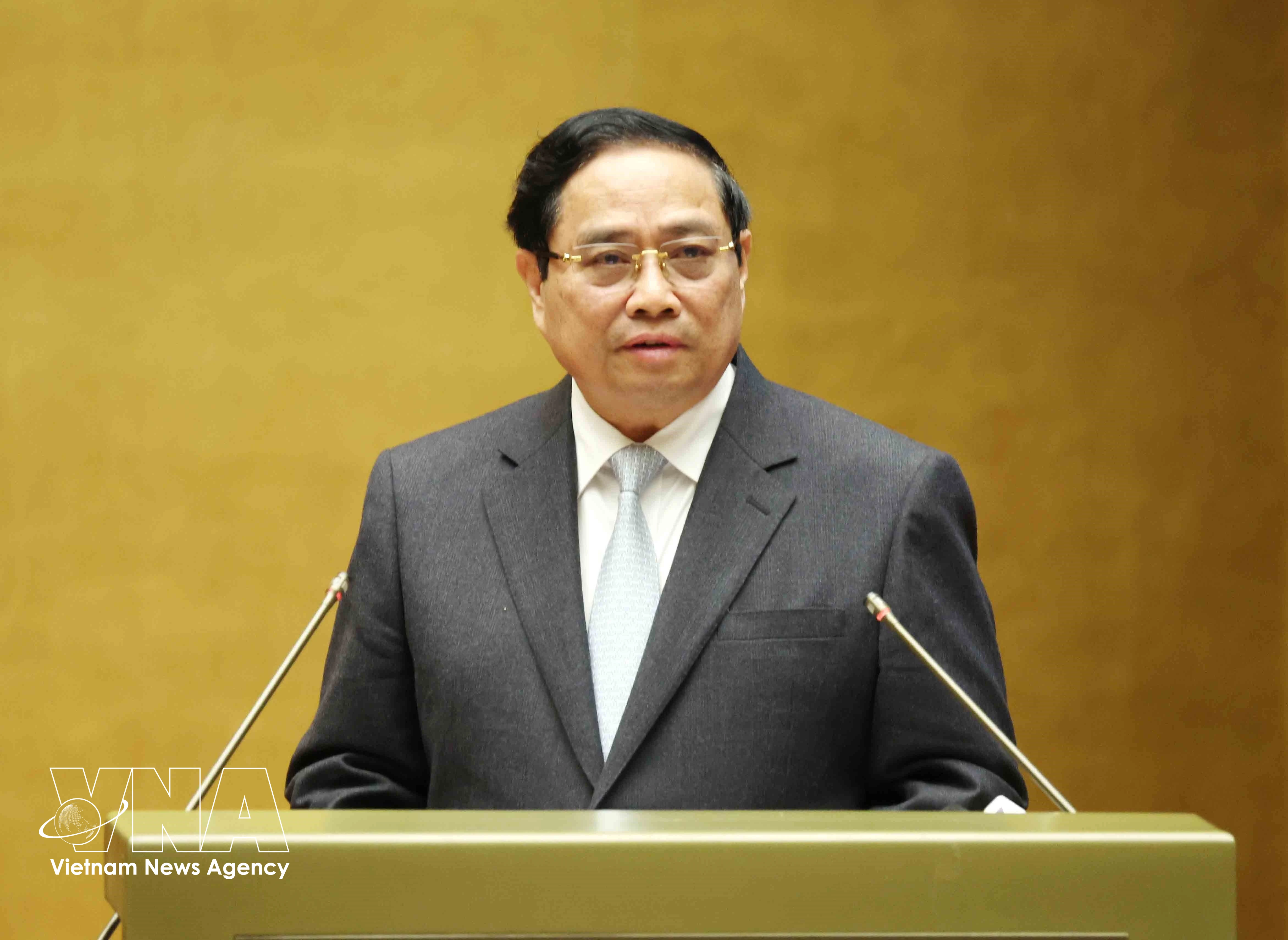 Prime Minister Pham Minh Chinh presents the action plan for implementing the Resolution of the 14th National Party Congress at the conference on February 7. (Photo: VNA)
