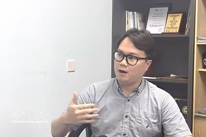 Malaysia-based researcher Enzo Sim Hong Jun grants an interview to the Vietnam News Agency. (Photo: VNA)