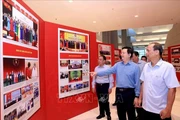 Deputy Prime Minister Mai Van Chinh (2nd from right) inspects preparations for the exhibitions on October 11. (Photo: VNA)